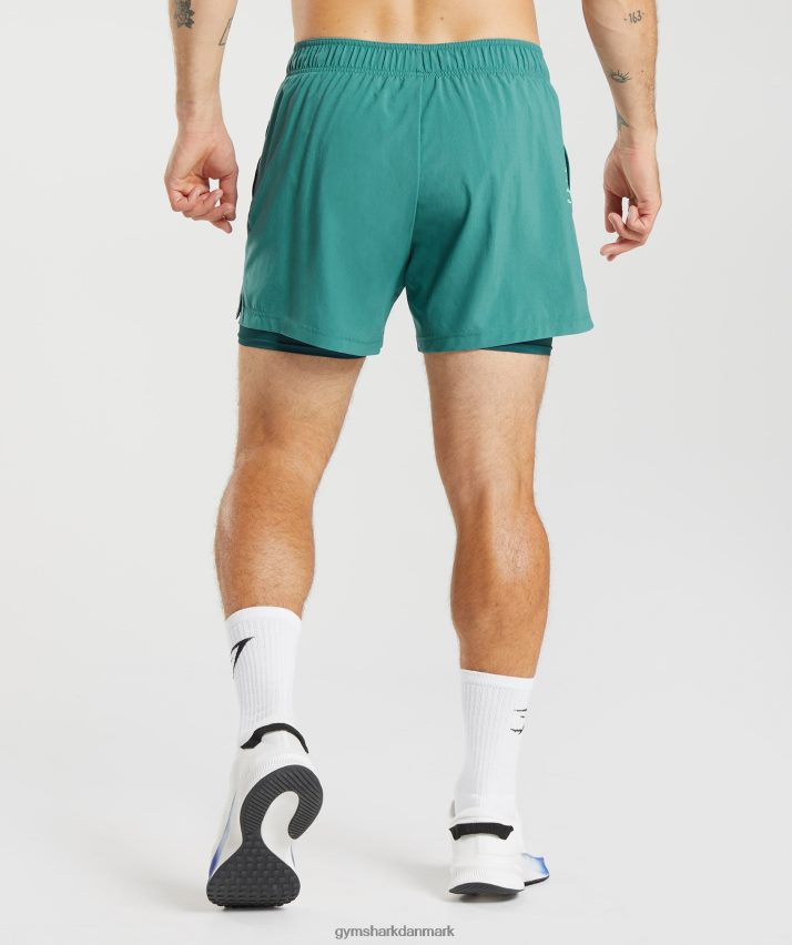Mænd Gymshark sport 5 2 i 1 shorts N4ZDDN558 skiferblå/vinter krikand