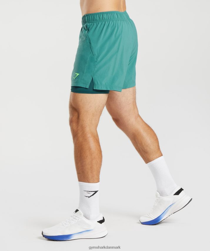 Mænd Gymshark sport 5 2 i 1 shorts N4ZDDN558 skiferblå/vinter krikand