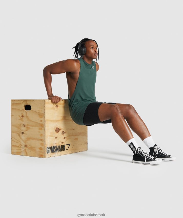 Mænd Gymshark kritisk 2.0 drop arm tank N4ZDDN931 mørkegrøn